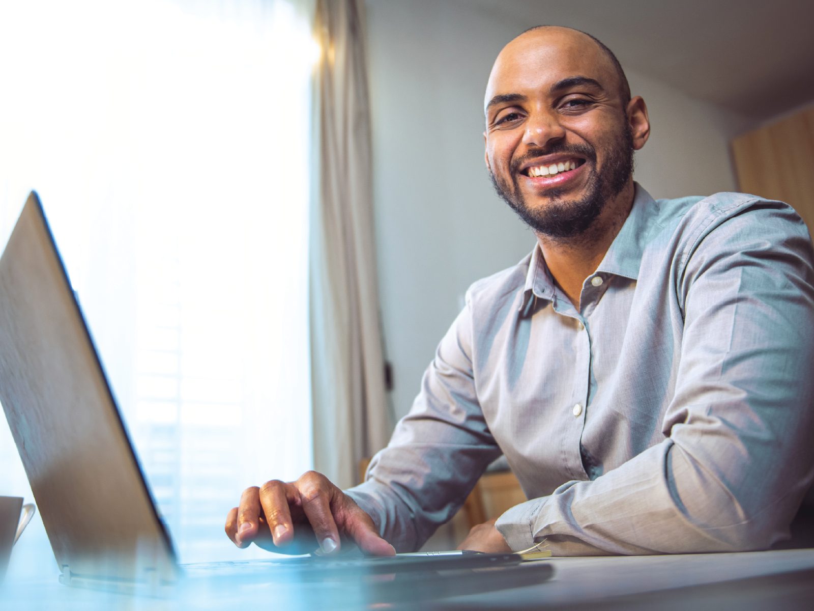 WayneLINC job seeker working on a laptop