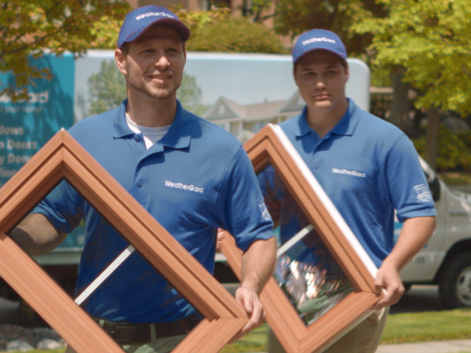 WeatherGard installers carrying a replacement window