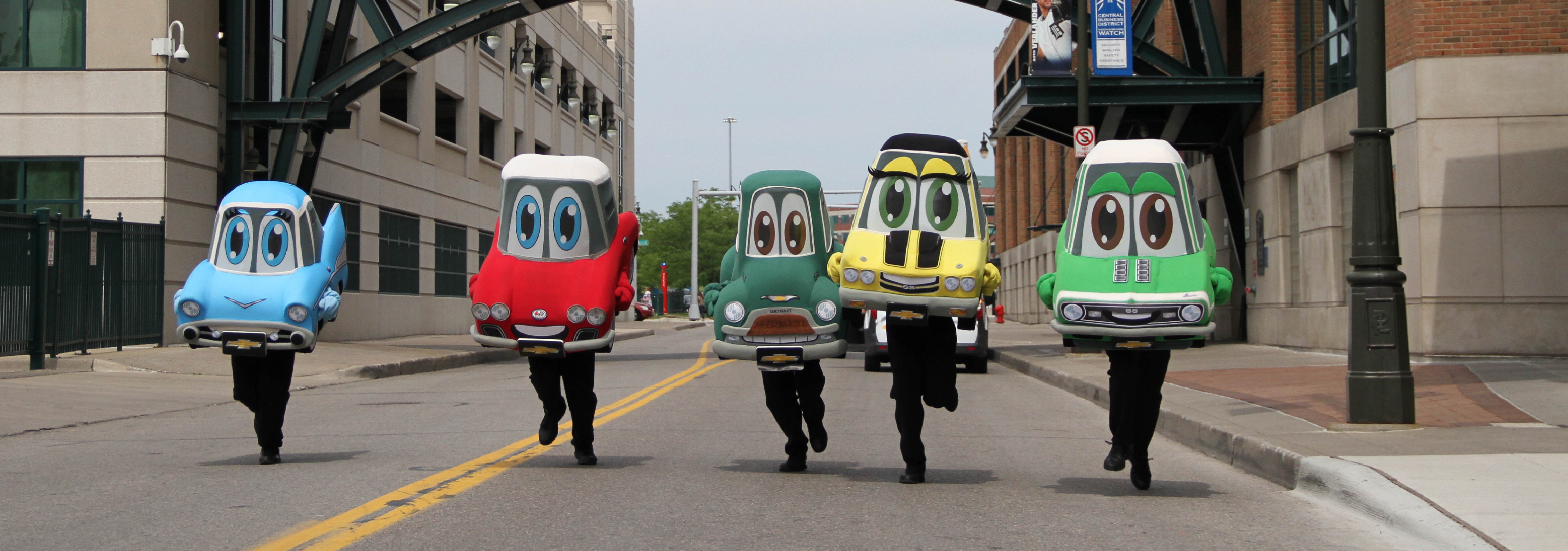 metro detroit chevy dealers mascots running through a street