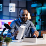 brand loyalty - customer unwrapping a new device